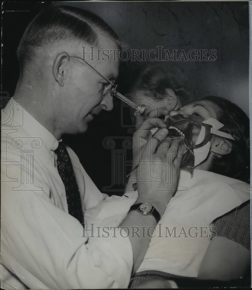 1936 Press Photo Dentist working on a patient&#39;s teeth - mja96292 - Historic Images
