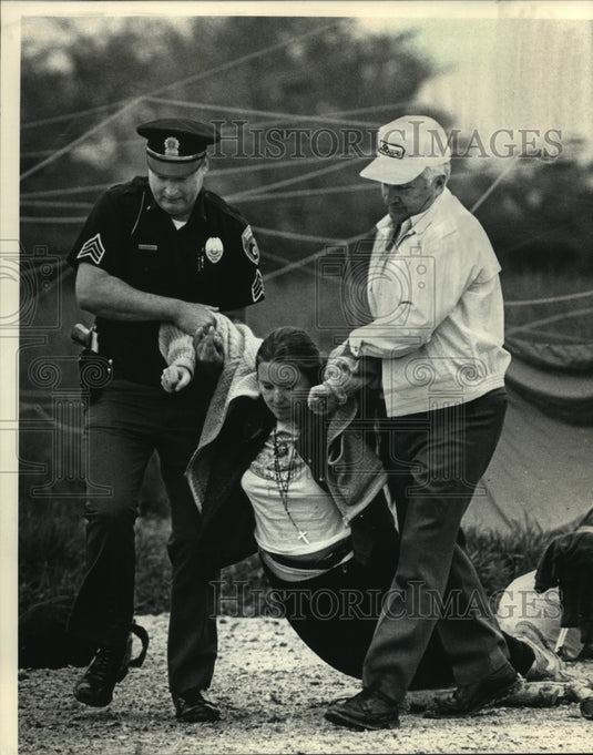 1986 Nuclear demonstrator Karen Henkel arrested for trespassing - Historic Images