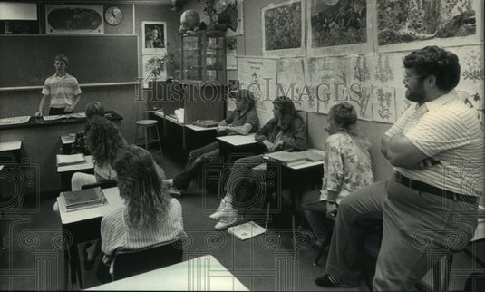 Students at Waukesha North High school present on characteristics of a fern. - Historic Images