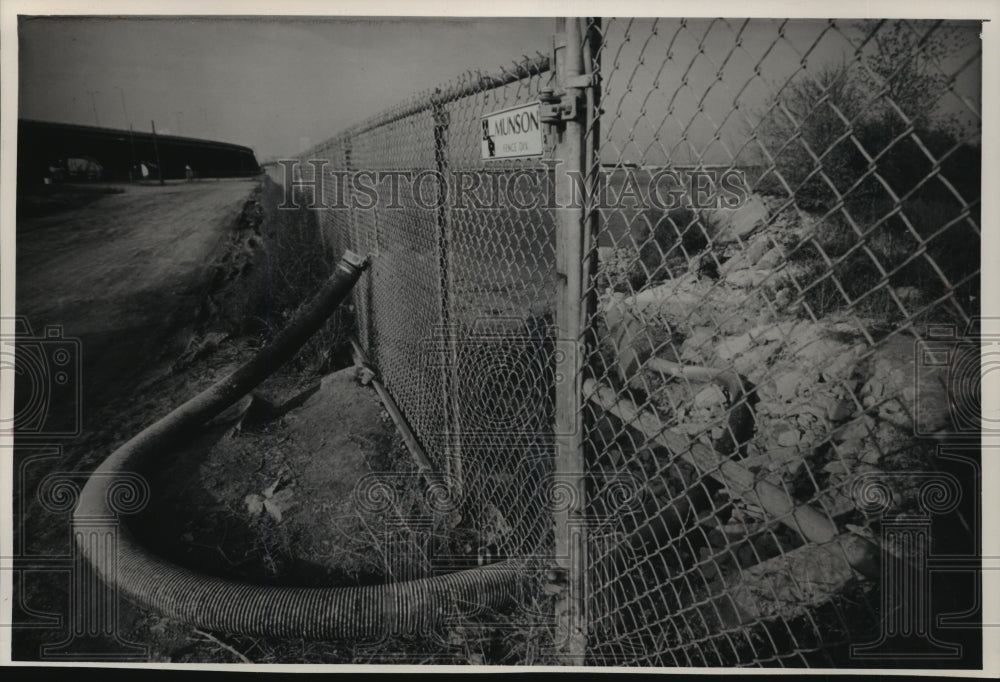 1988 Hose used to flush limestone silt into  landfill near Milwaukee - Historic Images