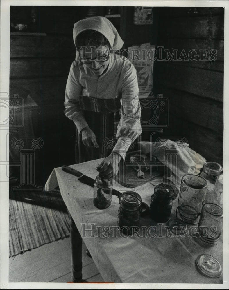 1977 Betty Isleb cans meat in Finn Farmhouse at Old World Wisconsin - Historic Images