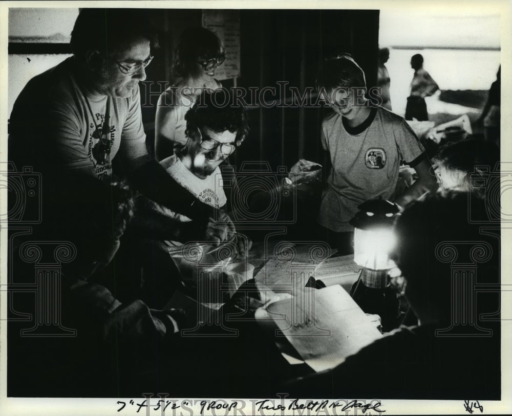 1981 Robert West and expedition members go over the day&#39;s work-Historic Images