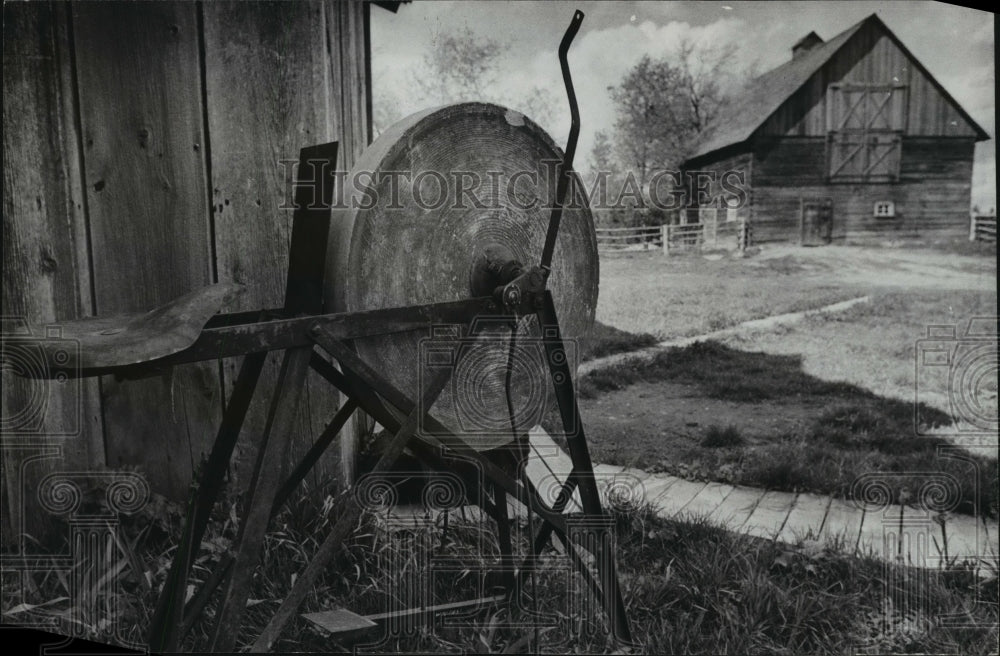 1977 grindstone at the Old World Museum Wisconsin - Historic Images