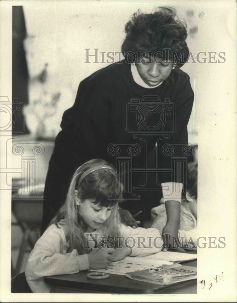 1988 Leslie Duvernay watches Allysa Lacoursier work on an assignment-Historic Images