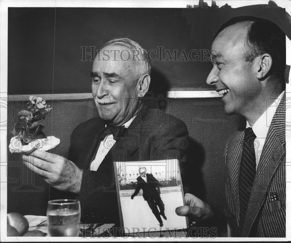 1955 Press Photo Richard S. Davis, with pot of begonias, Andy Galvin. Milwaukee- Historic Images