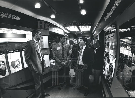 1991 Press Photo Scott Fergen Explains Capsylite at Electrical Expo of Wisconsin - Historic Images