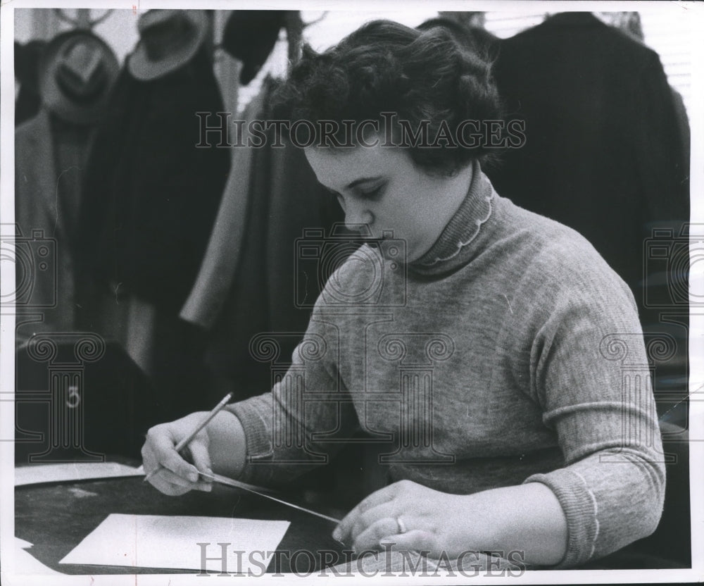 1955 Press Photo Audrey Seal receives the stock quotations. - mjb04472 - Historic Images