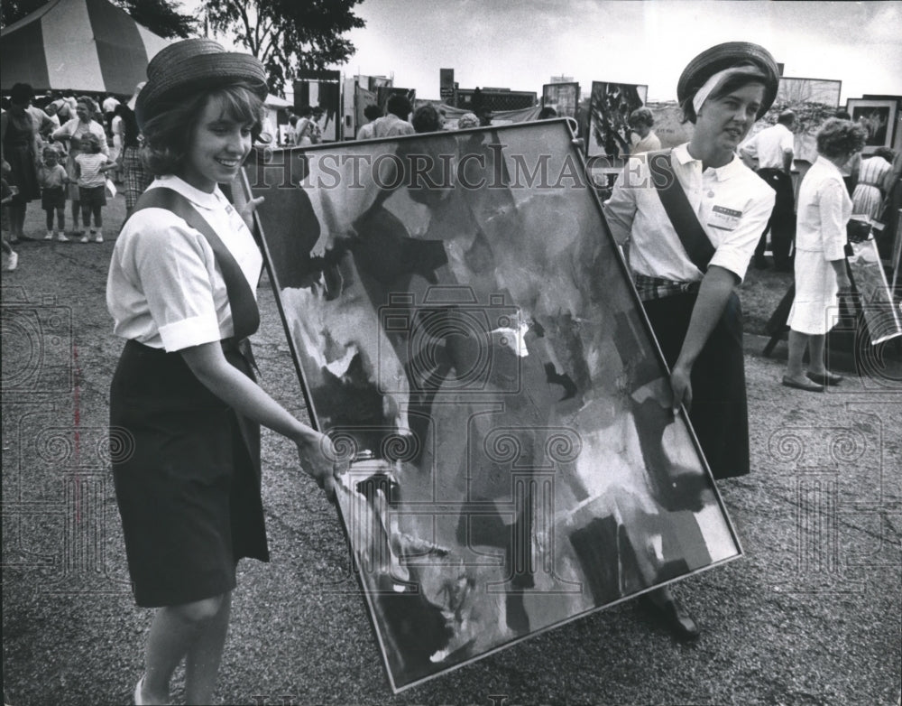 1963 Press Photo Festival of Arts, Marsha Byrne and Sally Son Carry Painting - Historic Images