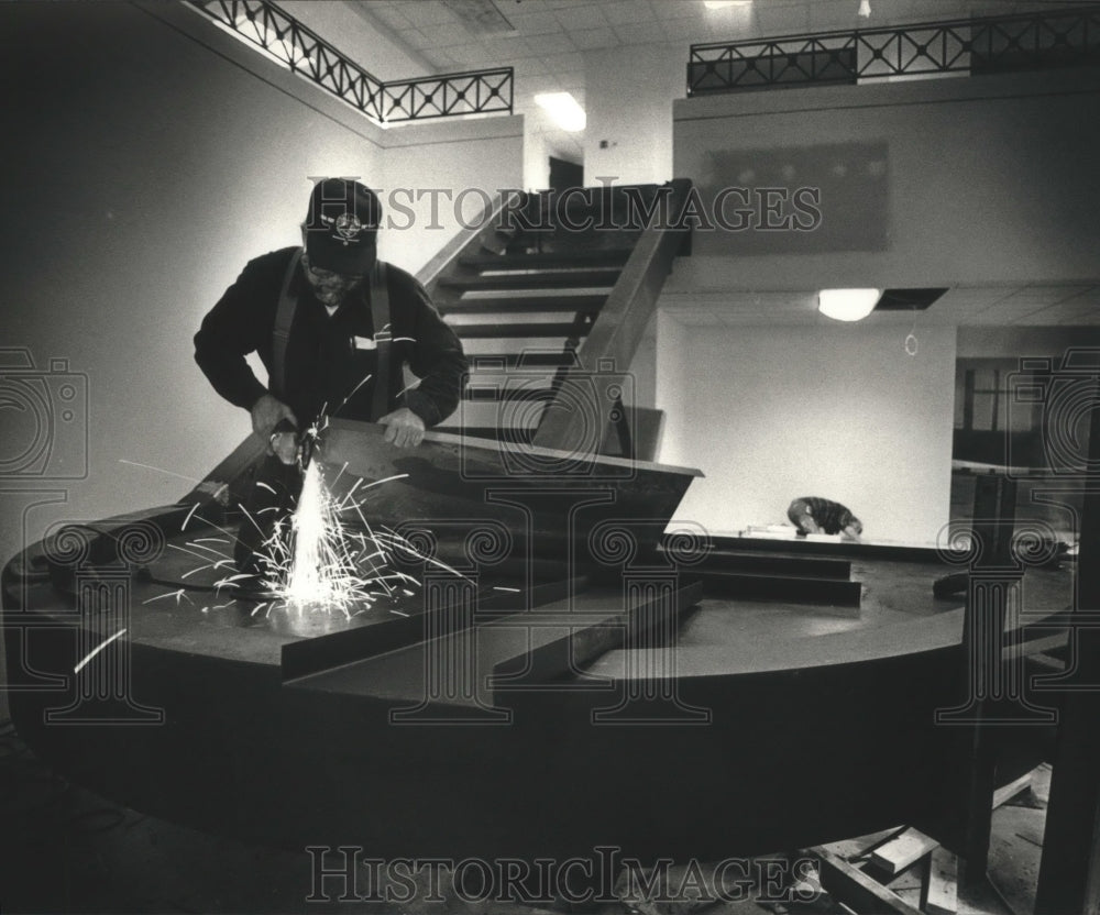 1989 Bill Metsa installs a staircase at the new LIberty Bank office - Historic Images