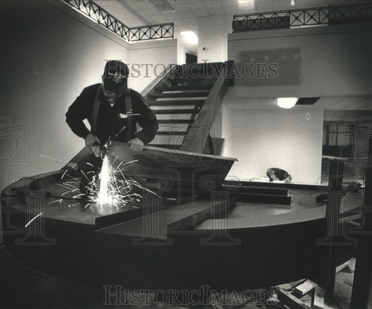 1989 Bill Metsa installs a staircase at the new LIberty Bank office - Historic Images