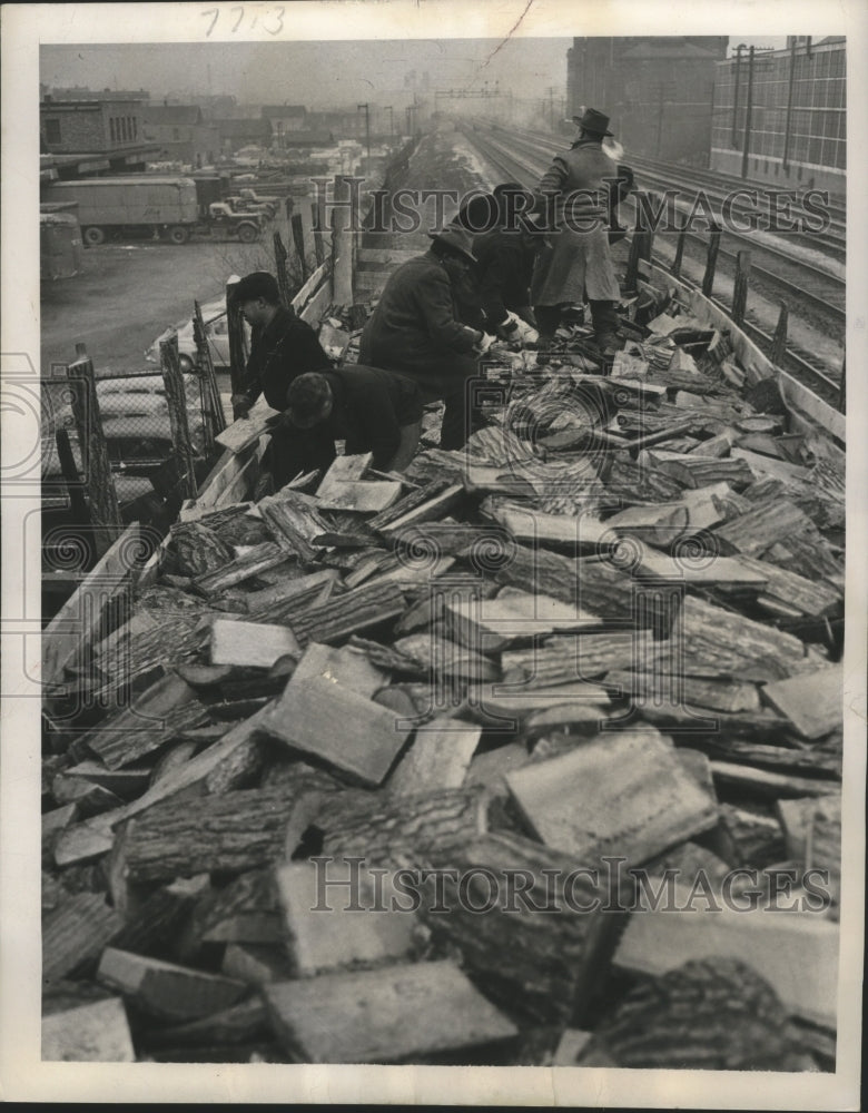 1950 Wood slabs being doled out to families on relief, Chicago.-Historic Images