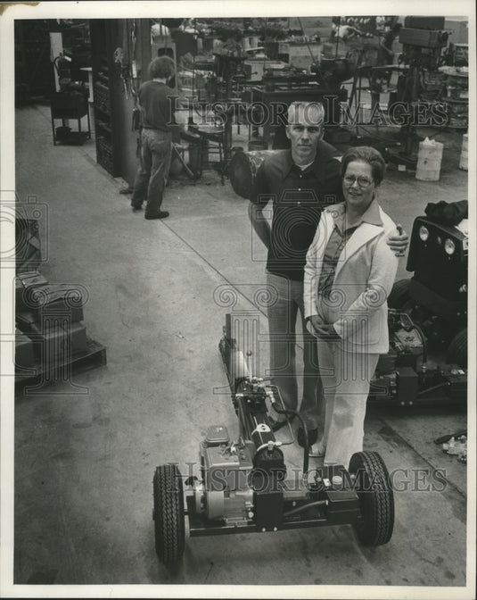 1977 Douglas Foster and wife, with a new wood splitter, Wisconsin.-Historic Images