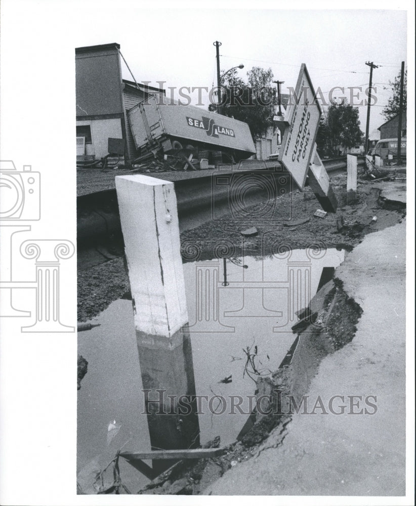 1967 Press Photo Floodwater erodes parking lot near Fairbanks News-Miner offices - Historic Images