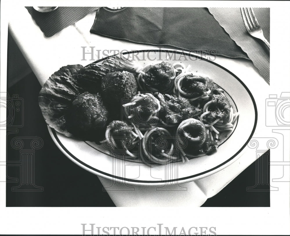 Press Photo Spaghetti Nests with Meatballs in Dinner Plate on Napkin-Historic Images