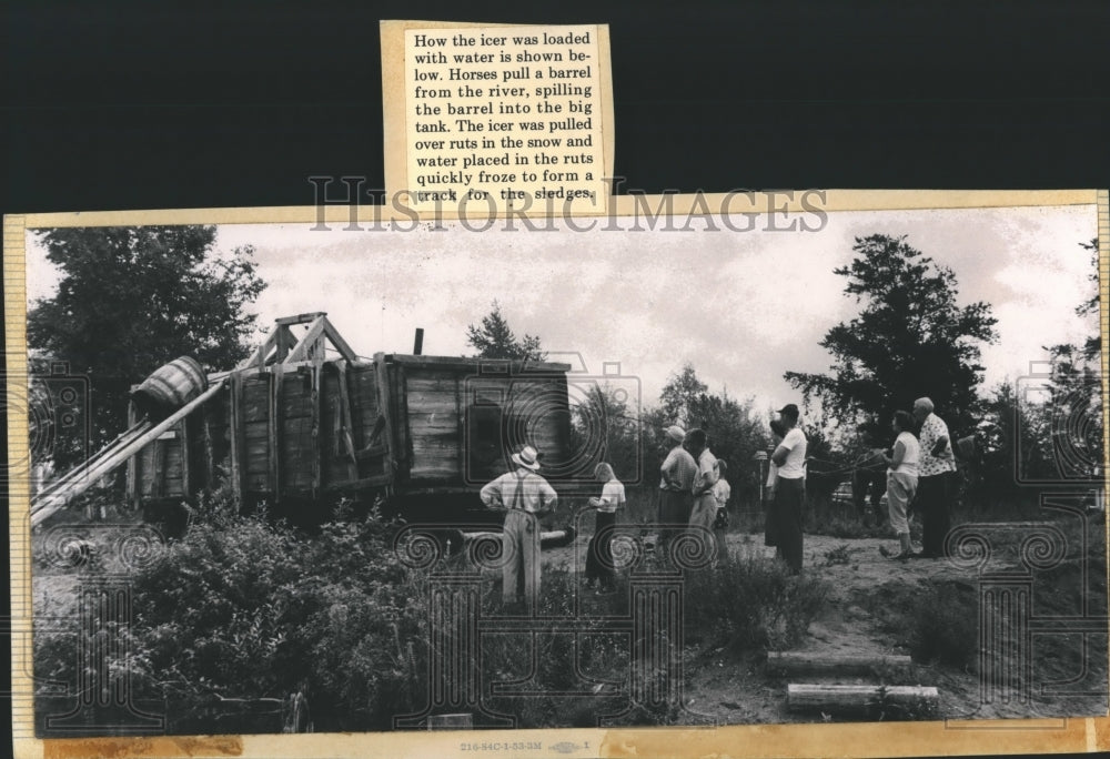 1955 Press Photo Icer loaded with Water by Barrels pulled by Horses from River-Historic Images