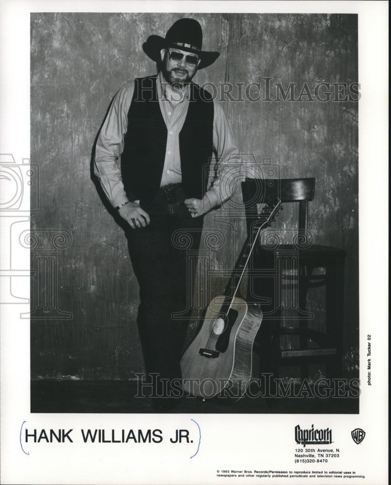 1983 Hank Williams Jr. Standing with Guitar Leaning on Chair - Historic Images