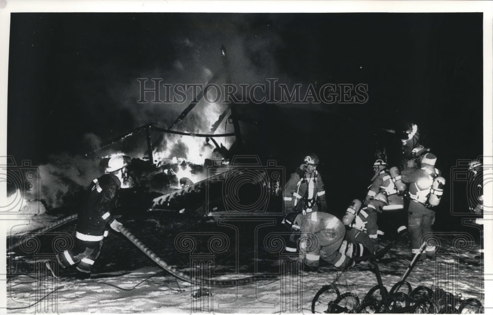 1991 Press Photo North Prairie Firefighters Work to Put Out a Barn Fire, Genesee- Historic Images