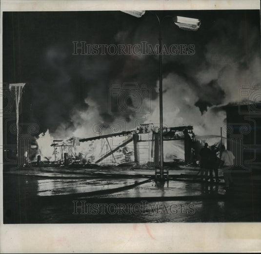1961 Press Photo Massvie Half-Block Fire Fells Firemen and Destroys Businesses - Historic Images