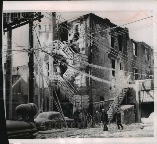 1964 Press Photo Firemen walk through ice after fire at Alamo Hotel in Illinois. - Historic Images