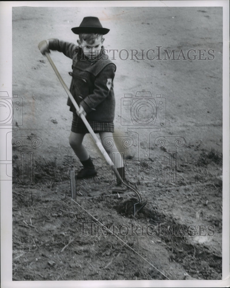 1958 Press Photo Young child Likes Gardening Too - mjb18232-Historic Images