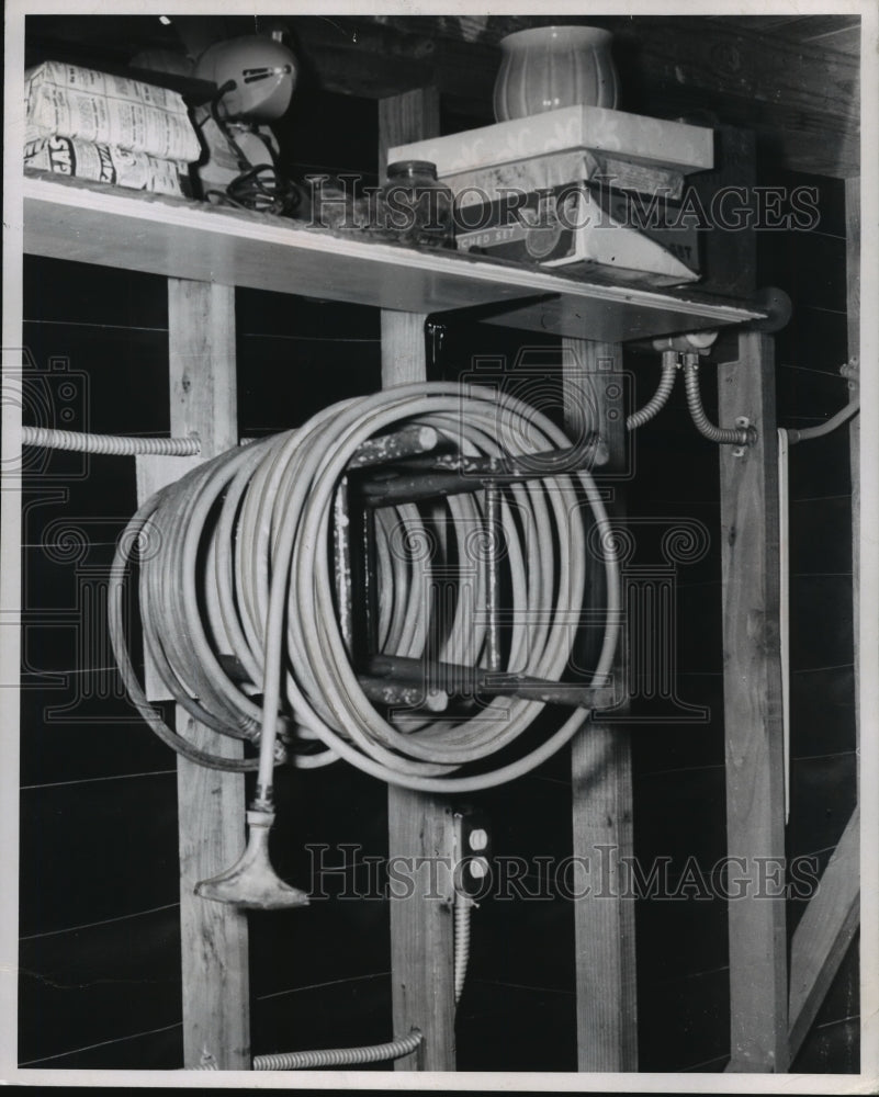 1958 Press Photo Old Chair Used to Store Wrapped Garden Hose - mjb18235-Historic Images