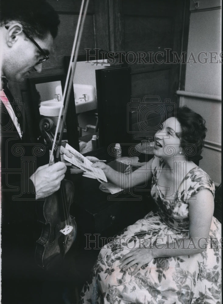 1958 Press Photo Pianist Moura Lympany Autographs a Program for Phillip Aaron-Historic Images