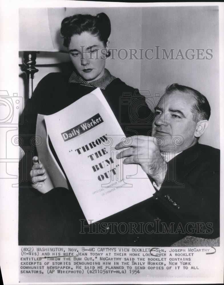 1954 Press Photo Senator Joseph McCarthy and his wife view a booklet - mjb19277 - Historic Images