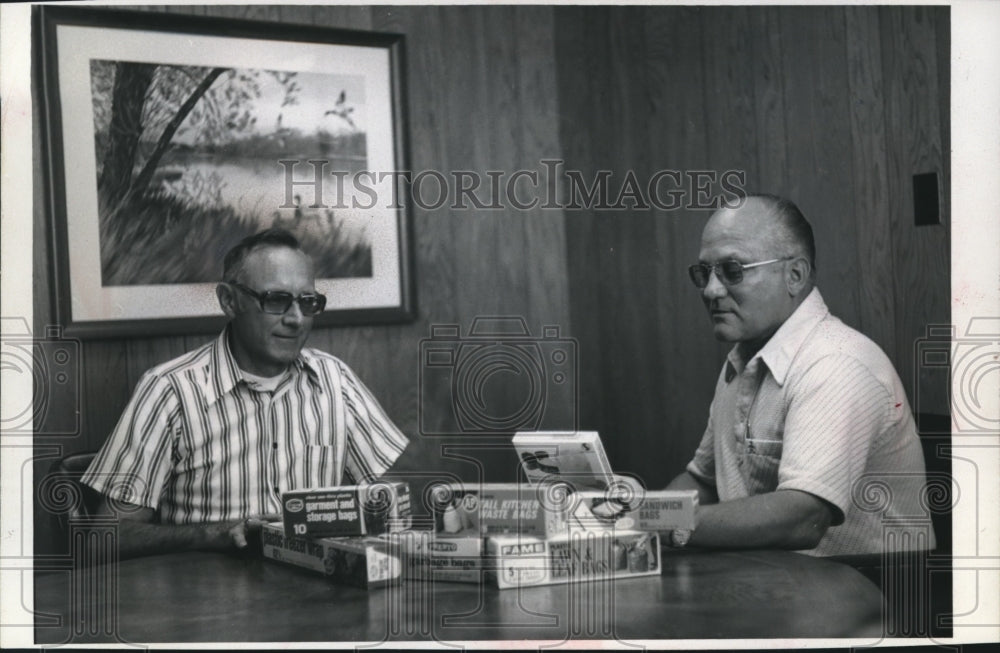 1975 John E. Lynch and Clarence E. Wallace discuss Presto Products-Historic Images