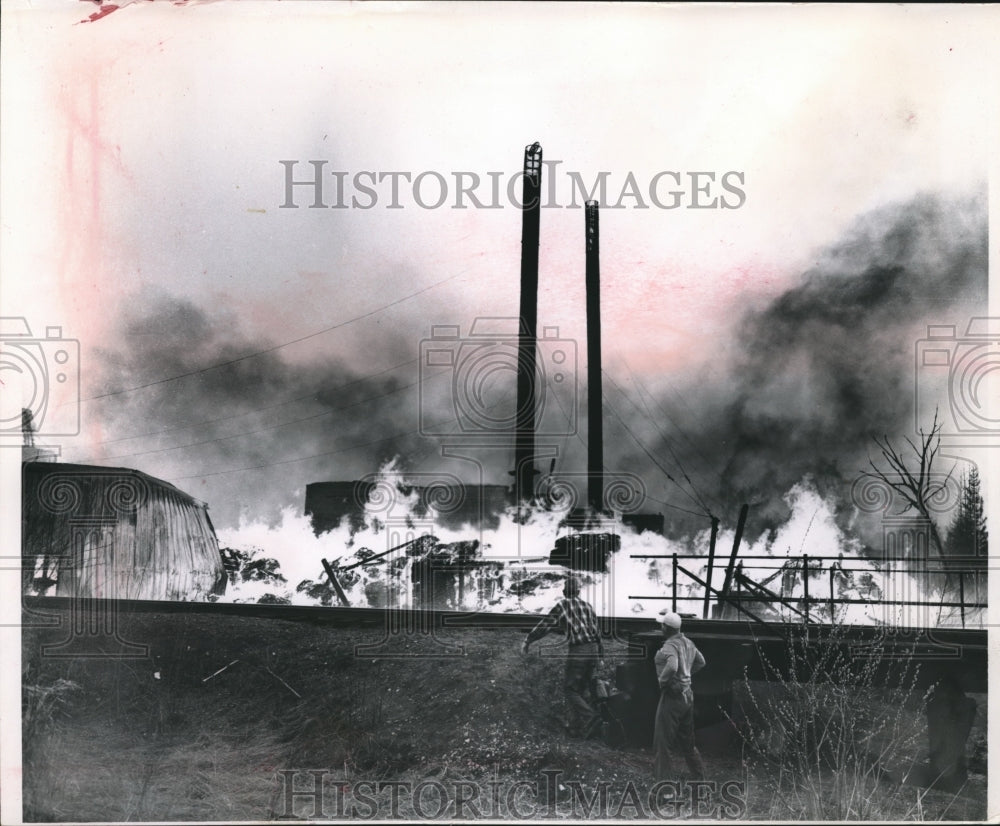 1964 Press Photo Firemen fight a fire at an industrial complex in Butternut - Historic Images