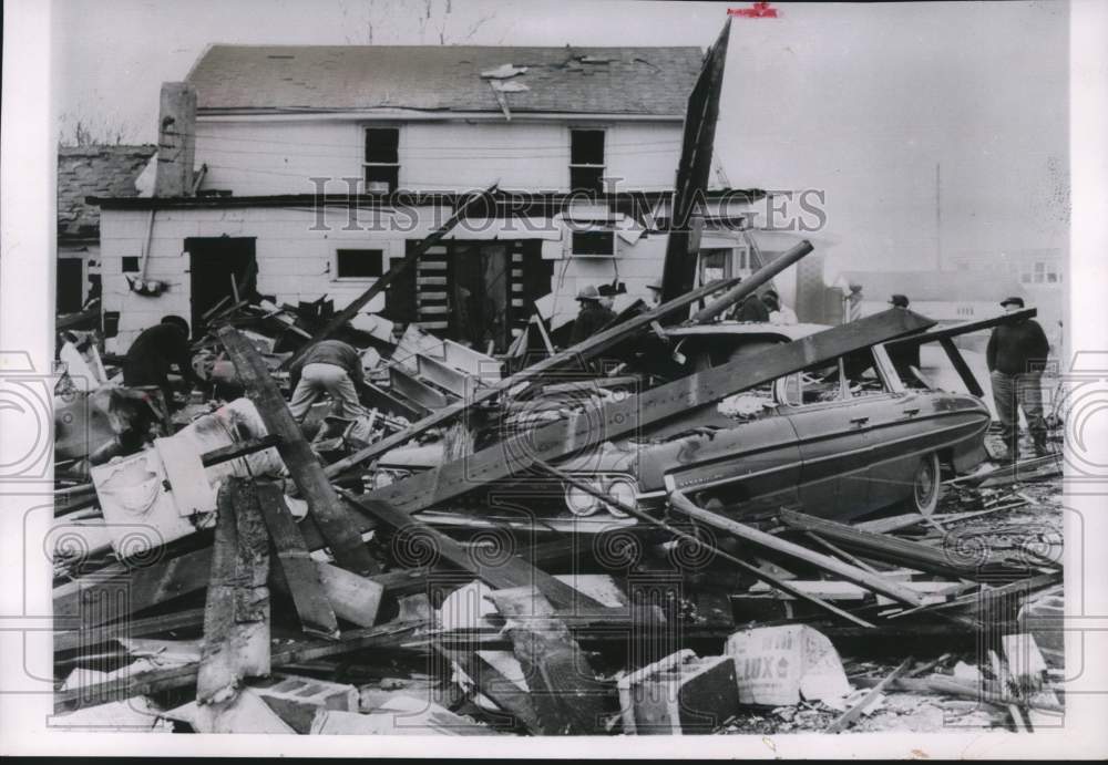 1963 Car covered in rubble after explosion, Terre Haute, Indiana - Historic Images