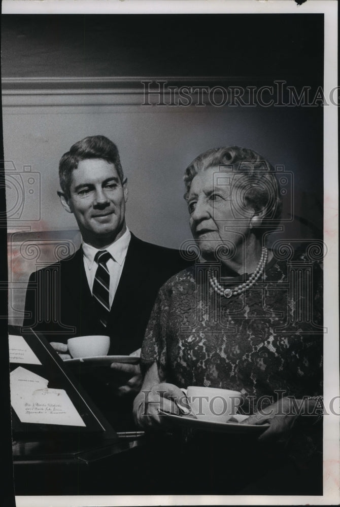 1964 Press Photo Mark Gormley and Mrs. Nestlbichler, looking at book, Wisconsin. - Historic Images