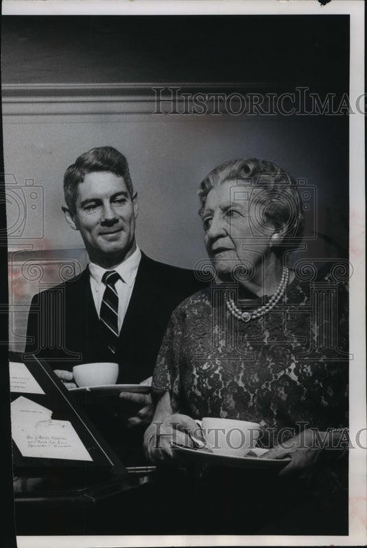 1964 Press Photo Mark Gormley and Mrs. Nestlbichler, looking at book, Wisconsin. - Historic Images