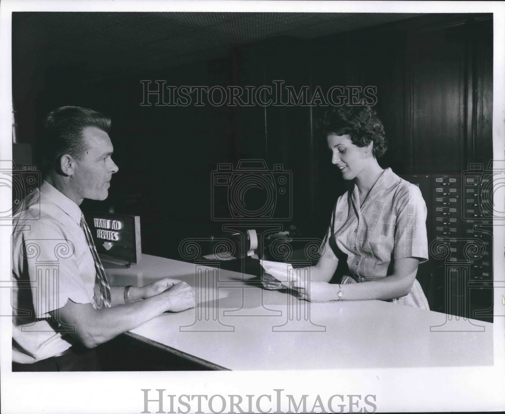 1962 Press Photo Employee and Customer in Lobby of Milwaukee Journal Sentinel - Historic Images