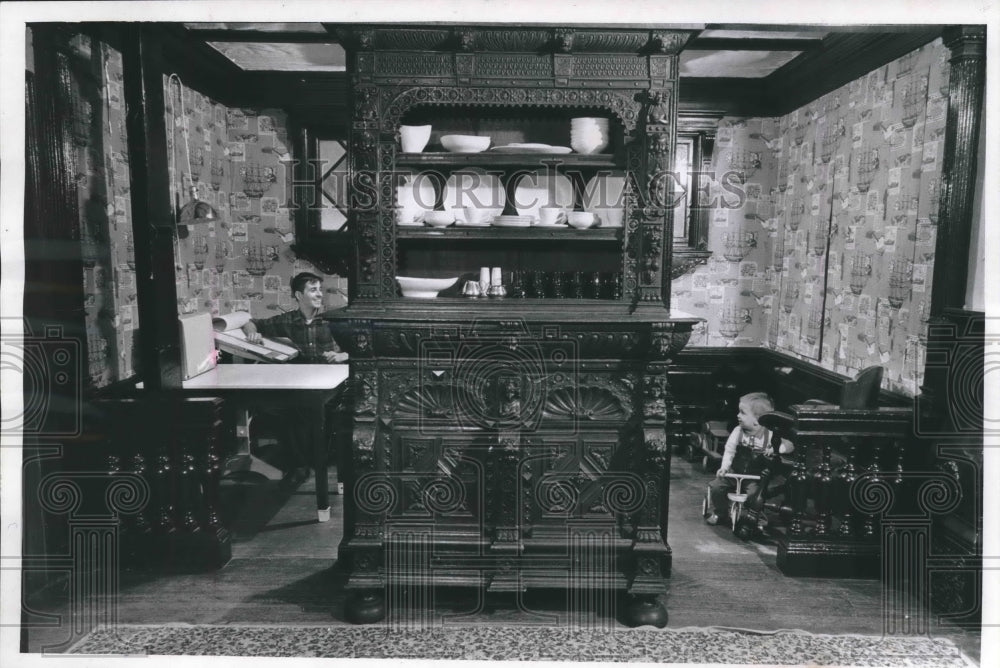 1964 Press Photo Don and his Son Sit Behind a 17th Century Cupboard at Home- Historic Images