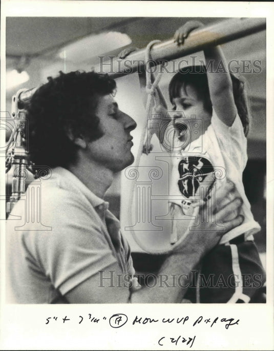 Gymnast Swerdlow helps Joshua Selkowits on a parallel bar-Historic Images