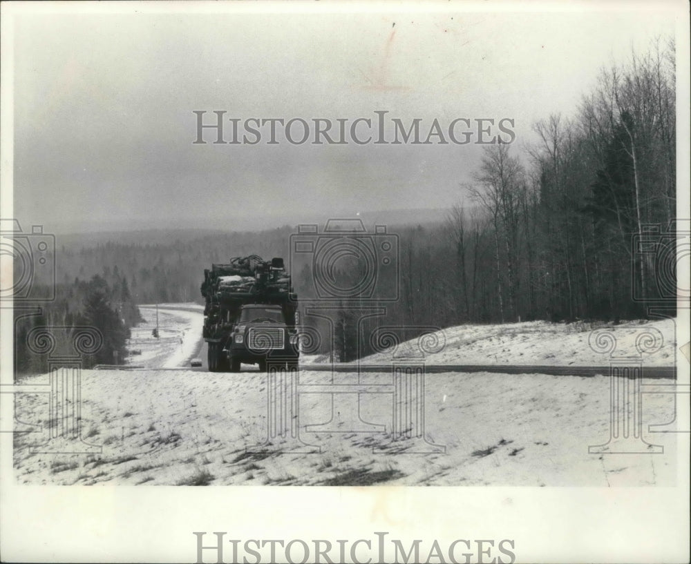 1975 A truck drives up Highway 141 south of Amasa, Wisconsin-Historic Images