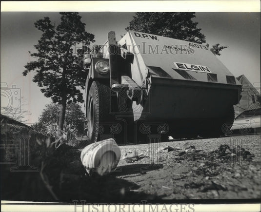 1979 Debris cast about from city street sweeping vehicle, Milwaukee.-Historic Images