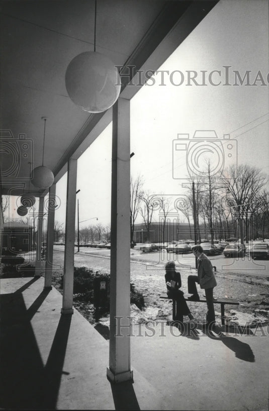 1975 Carmen Young and Kenneth Ripp chat on Milton College Campus-Historic Images