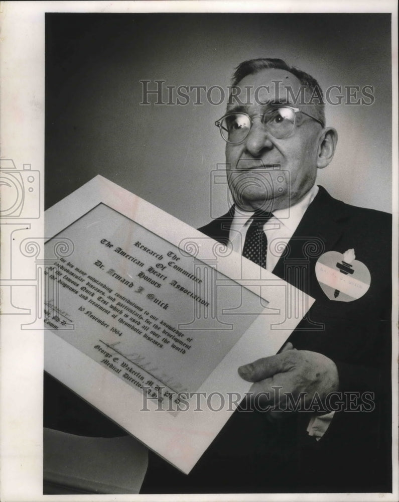 1964 Dr. Armand Quick shows citation from American Heart Assoc. WI-Historic Images