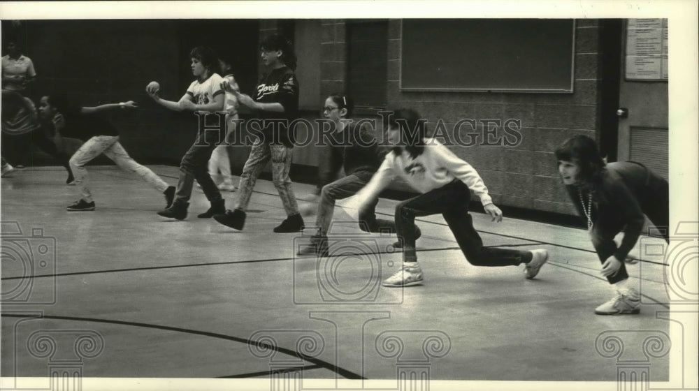 1988 Fifth-grade girls practice bowling in school gym, Milwaukee.-Historic Images