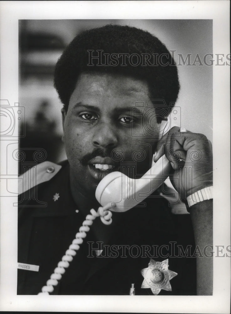 1975 Press Photo Leonce C. Rhodes, Public Relations Specialist Fire and Police.-Historic Images
