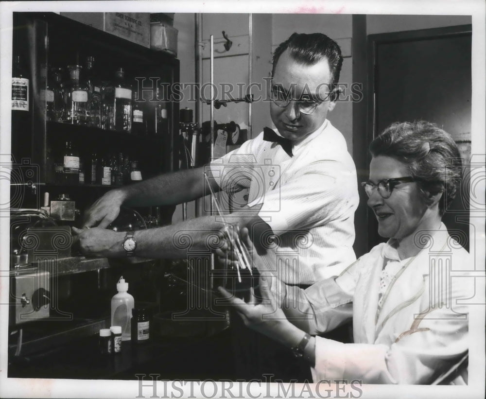1962 Drs. James and Elizabeth Miller studying chemical agents.-Historic Images