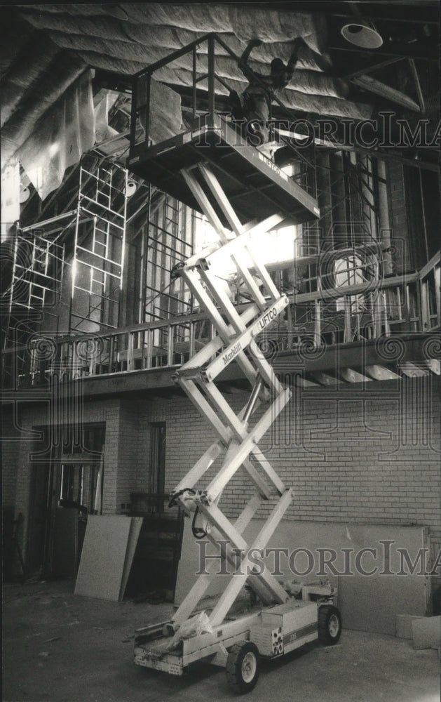 1993 A worker installs insulation in Northbrook Church in Richfield-Historic Images