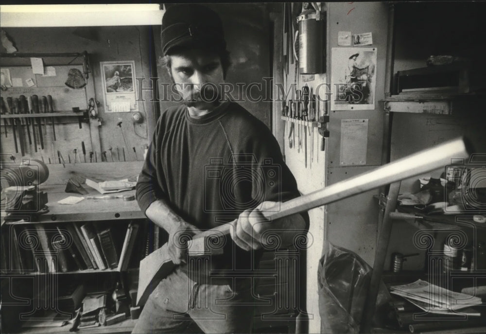 Press Photo Man tests fit of long rifle barrel in unfinished stock - mjb50373 - Historic Images
