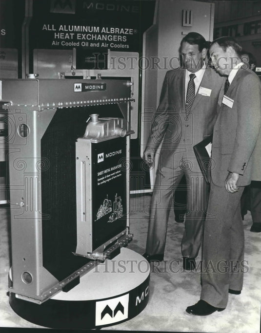 1972 James Mosier of Briggs and Stratton explains radiator to client-Historic Images