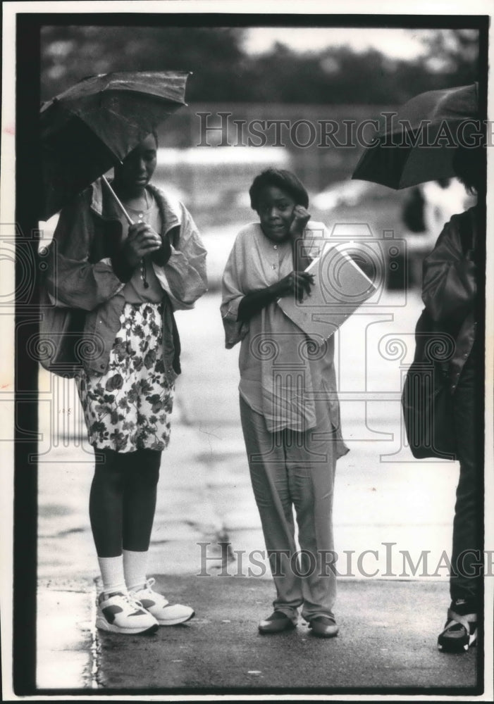 1992 Eighth graders stand outside school in rainy weather, Milwaukee-Historic Images