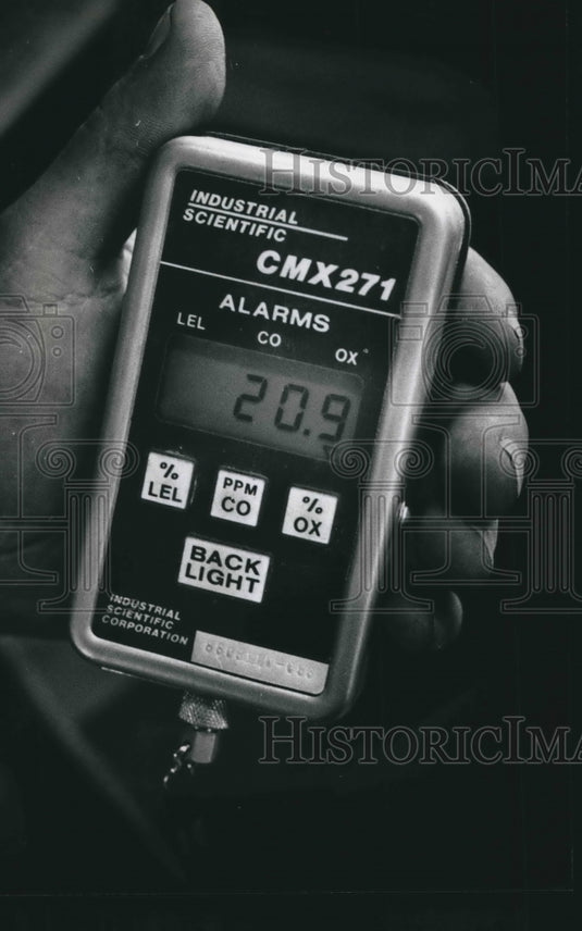 1989 sewer construction worker holds methane detector in MIiwaukee-Historic Images