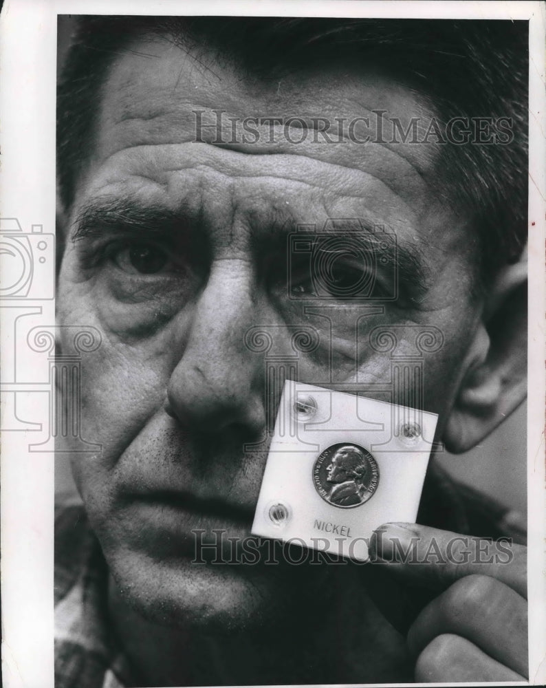1965 George Camp holds solid copper 1961 nickel.-Historic Images