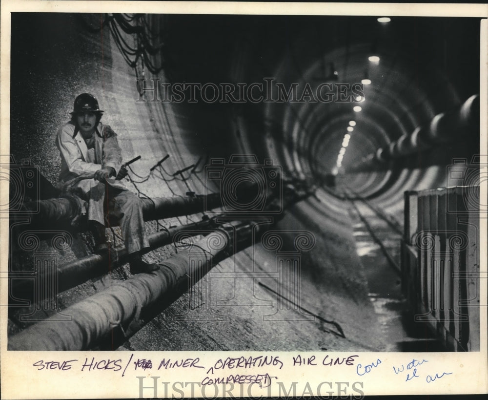 1986 Steve Hicks of Milwaukee, Construction Miner perched on pipes-Historic Images
