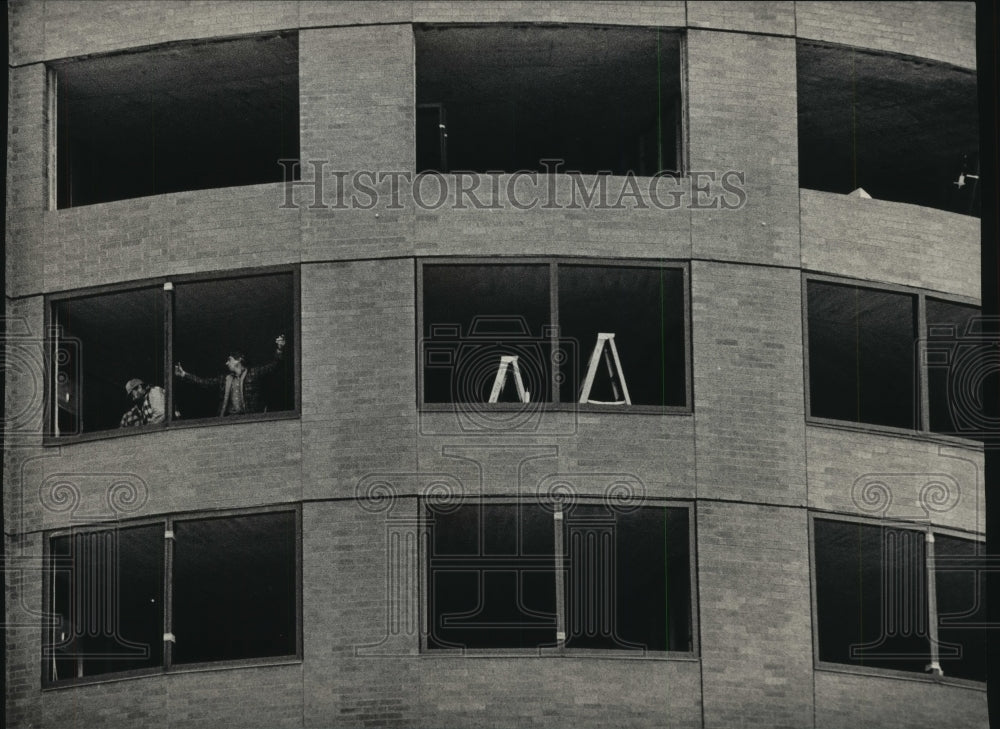 1987 Workmen installing windows at the Milwaukee Center - Historic Images